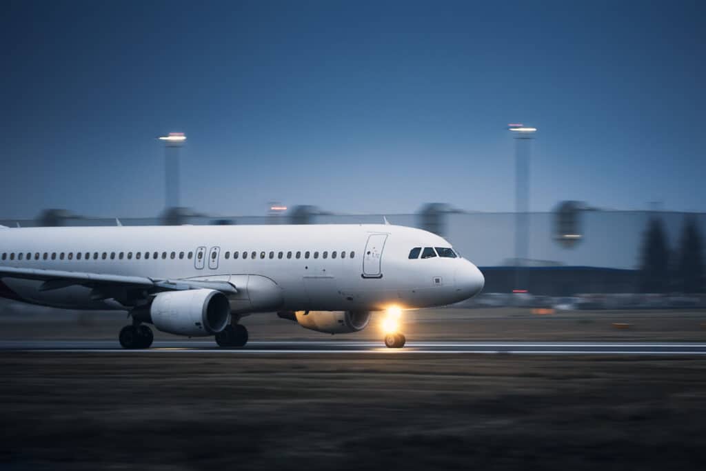 Airplane during take off on airport runway
